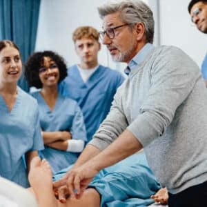Senior doctor teaching students on an accredited Train The Trainers course