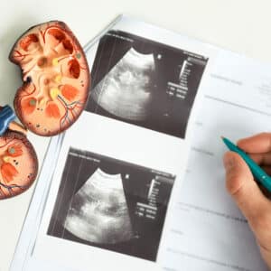 Doctor preparing for the FRCS Urol Part A Exam with Question Bank