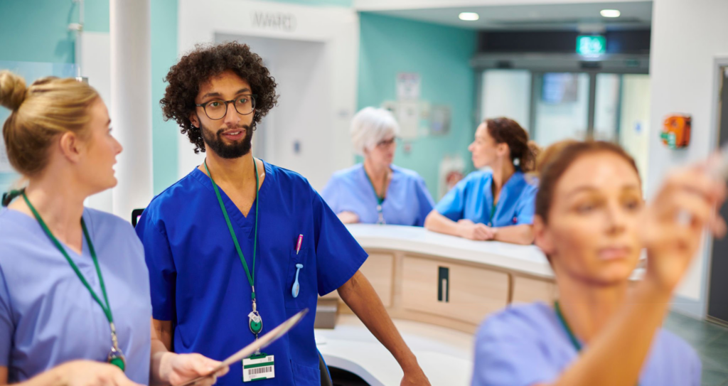 Healthcare professionals discussing in hospital setting.