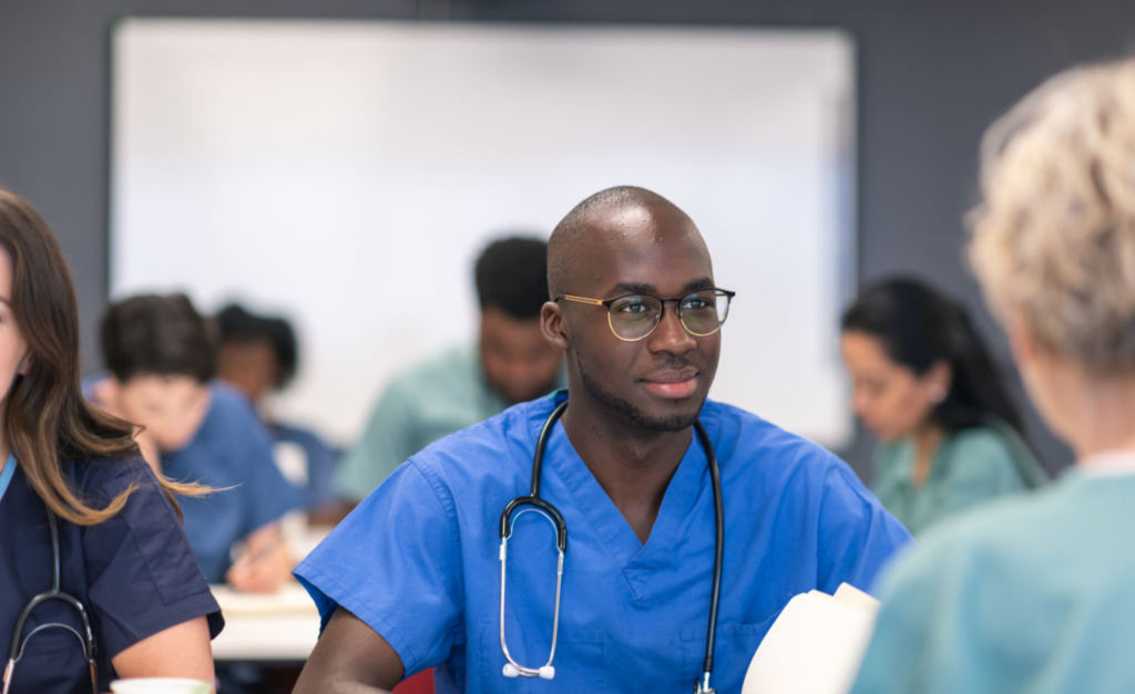 Medical students engaged in classroom learning session.