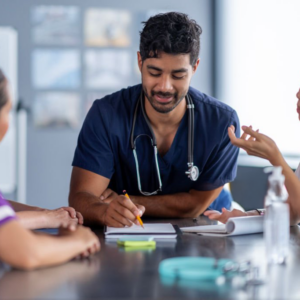 Healthcare team in discussion around table.