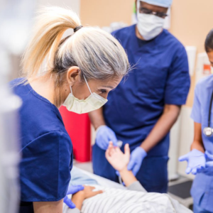 Medical team caring for a patient in hospital