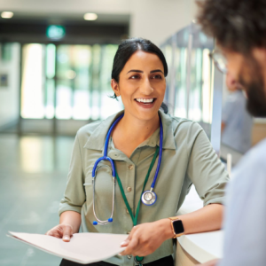 Doctor smiling at hospital reception
